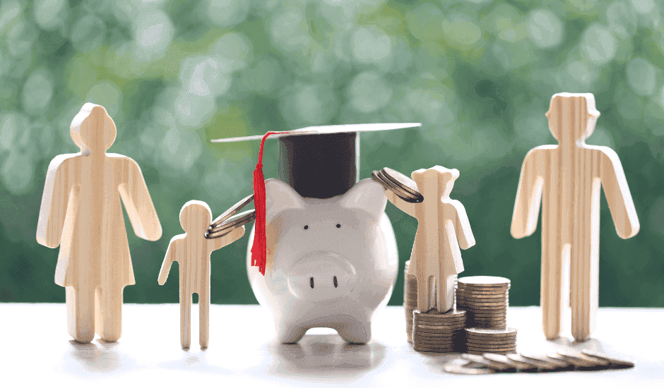 Piggy bank surrounded by figures, with a mortar board on top and money scattered around, symbolising the impact of the UK budget on schools.